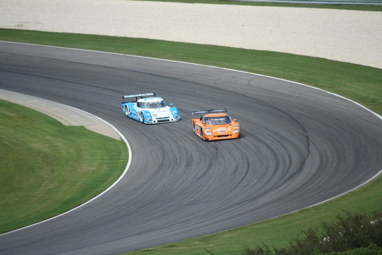 a close up of a car racing around a track