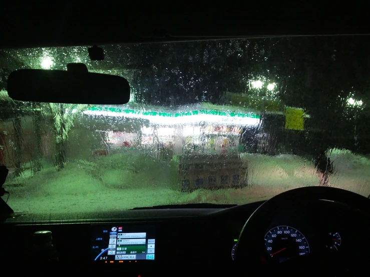 an image of a street light through a car's windshield