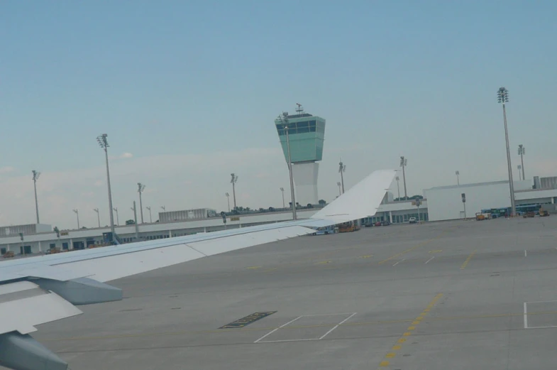 an airplane wing is shown on a tarmac