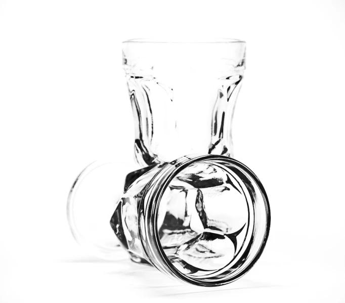 an empty glass is seen in the middle of this pograph