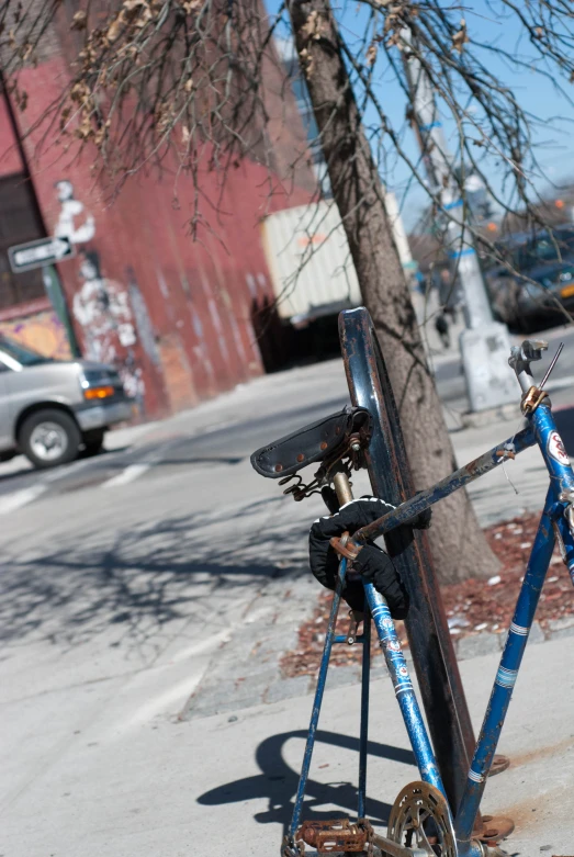 a street sign made of broken blue and silver scaffolding