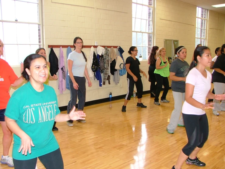 a group of people in a gym exercise