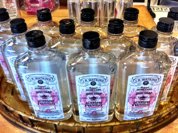 bottles of gin are arranged on a metal tray