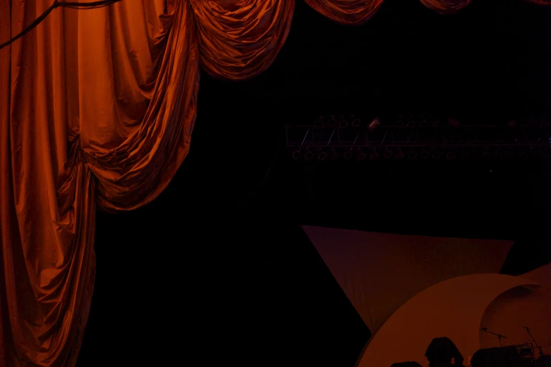 a picture of an stage with curtains and lights
