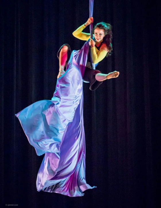 two women wearing costume are dancing and holding their hands behind their backs