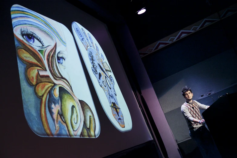 man in front of an interactive projector screen