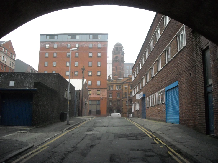 a picture from an underpass in the back of a building