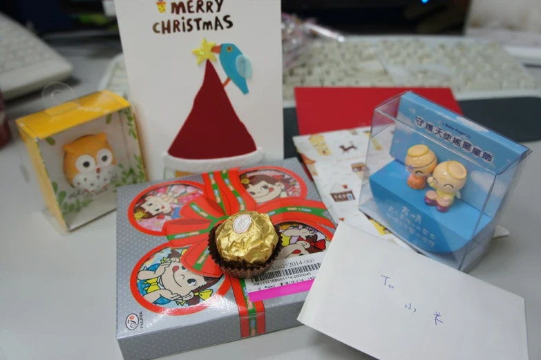 a christmas present with its wrapper box, and its present card