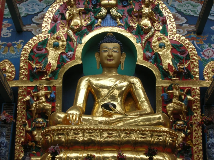 a golden buddha statue in a chinese temple