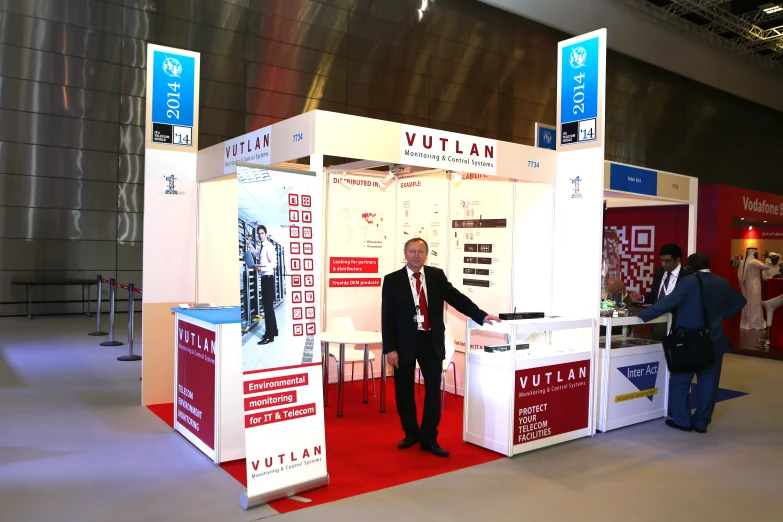 a man standing in front of a booth of some kind