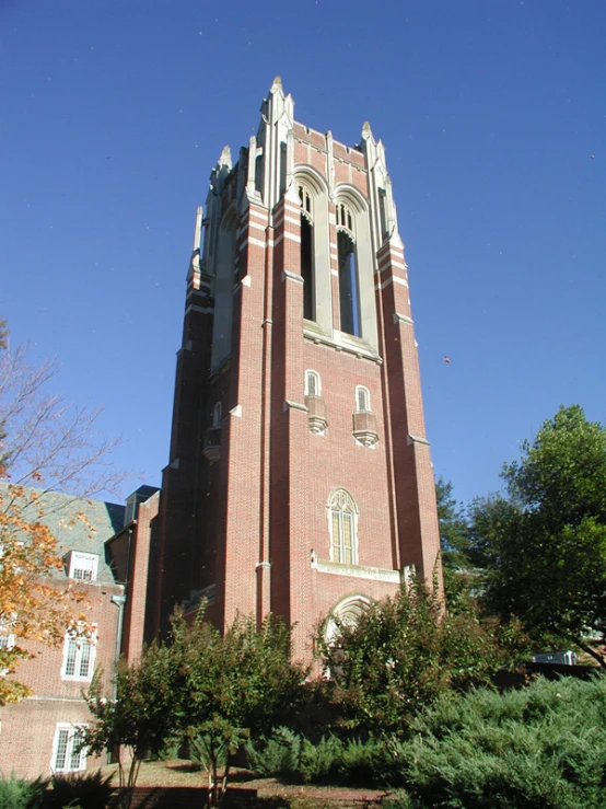 a large brick tower with clock displayed on top