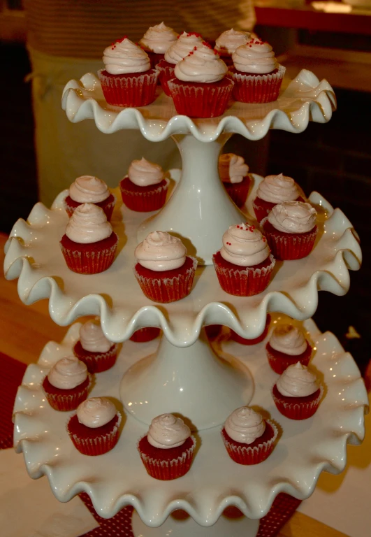 three tiered tray with red velvet cupcakes