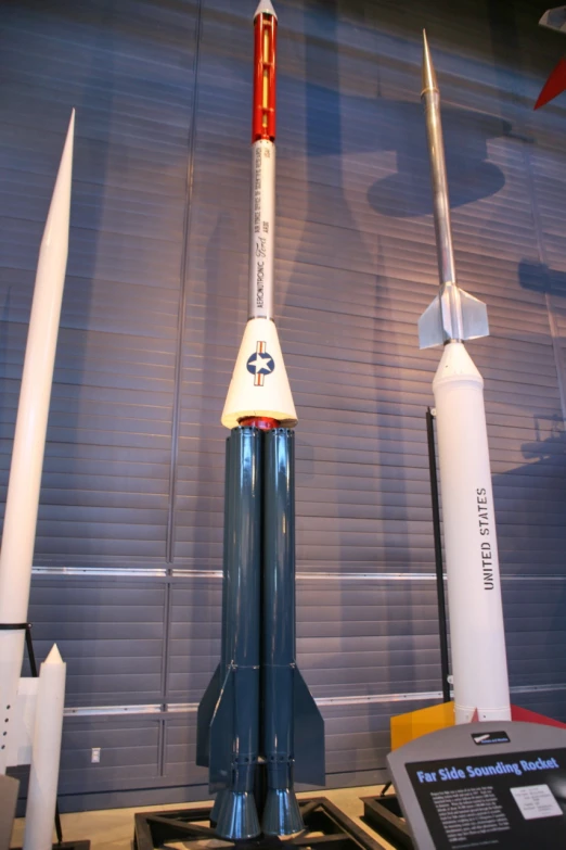a model of an earth science rocket on display in a building