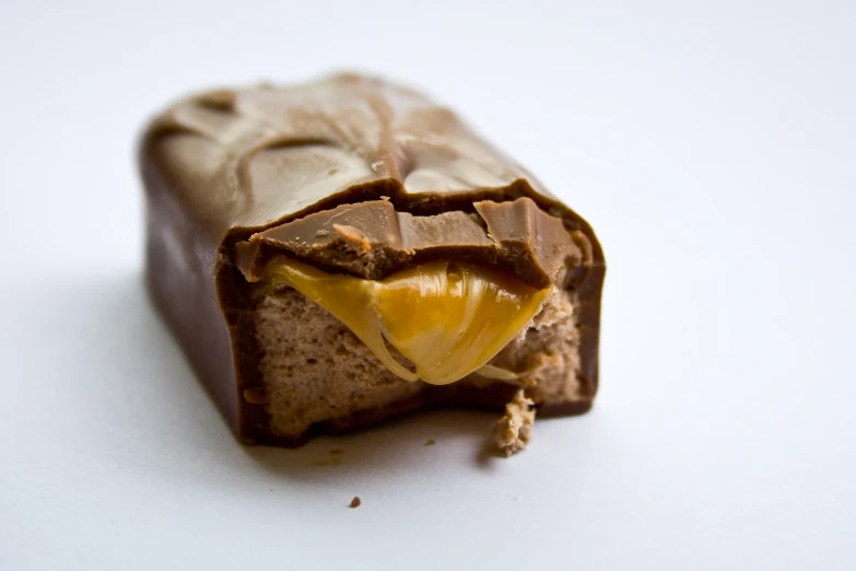 a brown candy with nuts, chocolate and banana