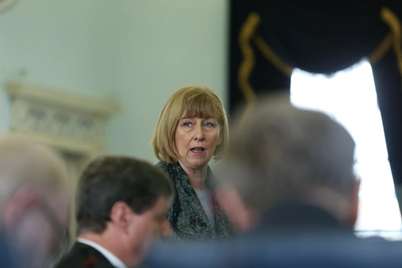 a woman that is standing up at a table