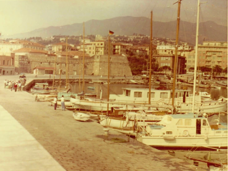 a row of parked sail boats in a marina