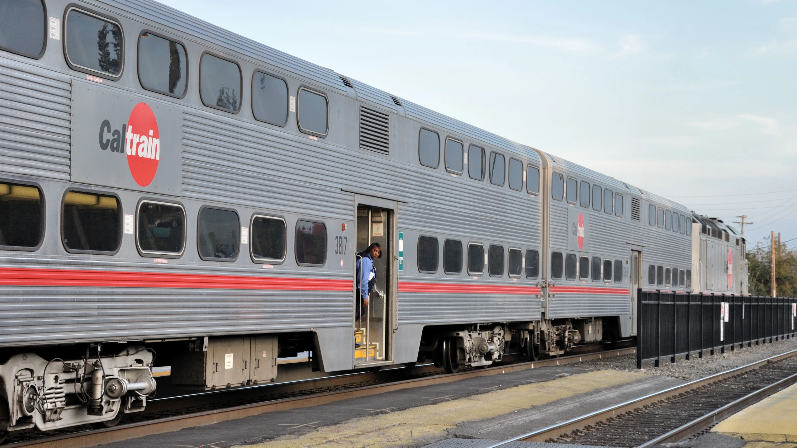 the train with a man is boarding it