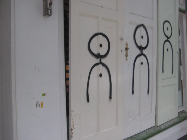 the doors of a house are adorned with artwork
