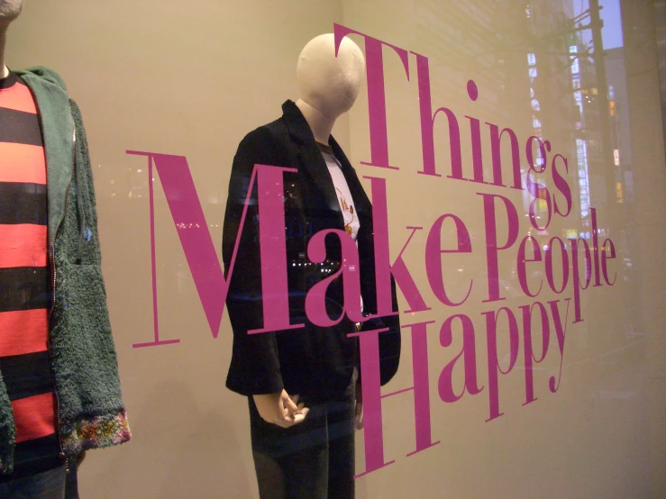 a mannequin has a pink and black stripe shirt on it