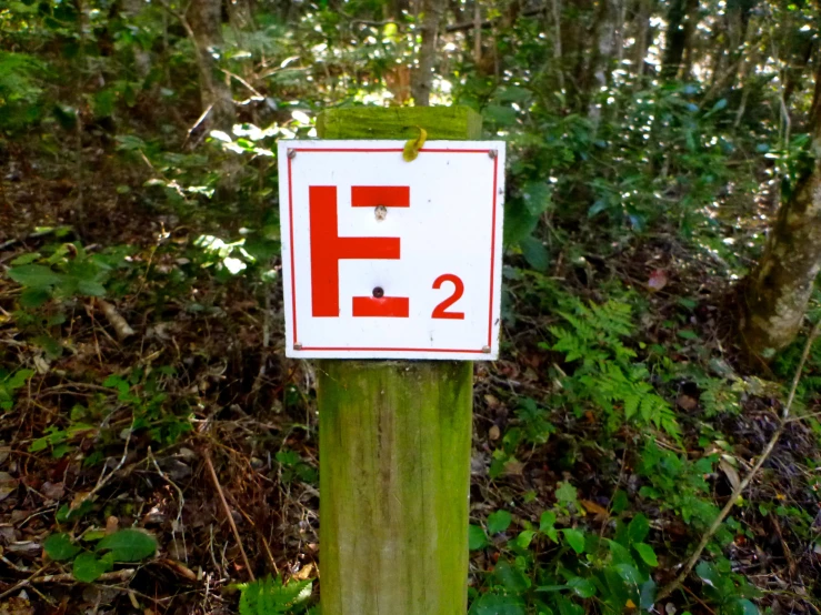a sign indicating the number two is placed on a pole