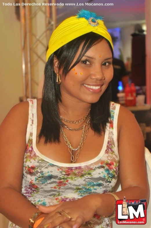 a woman with bright colors on her face smiling