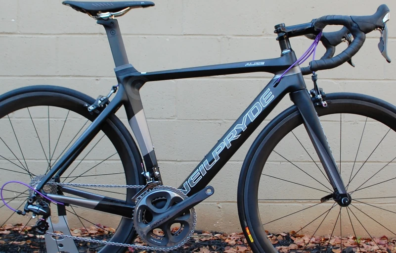 the bike is sitting by a wall