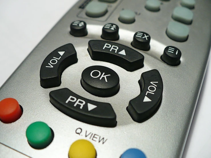 a remote control with three ons on a white background