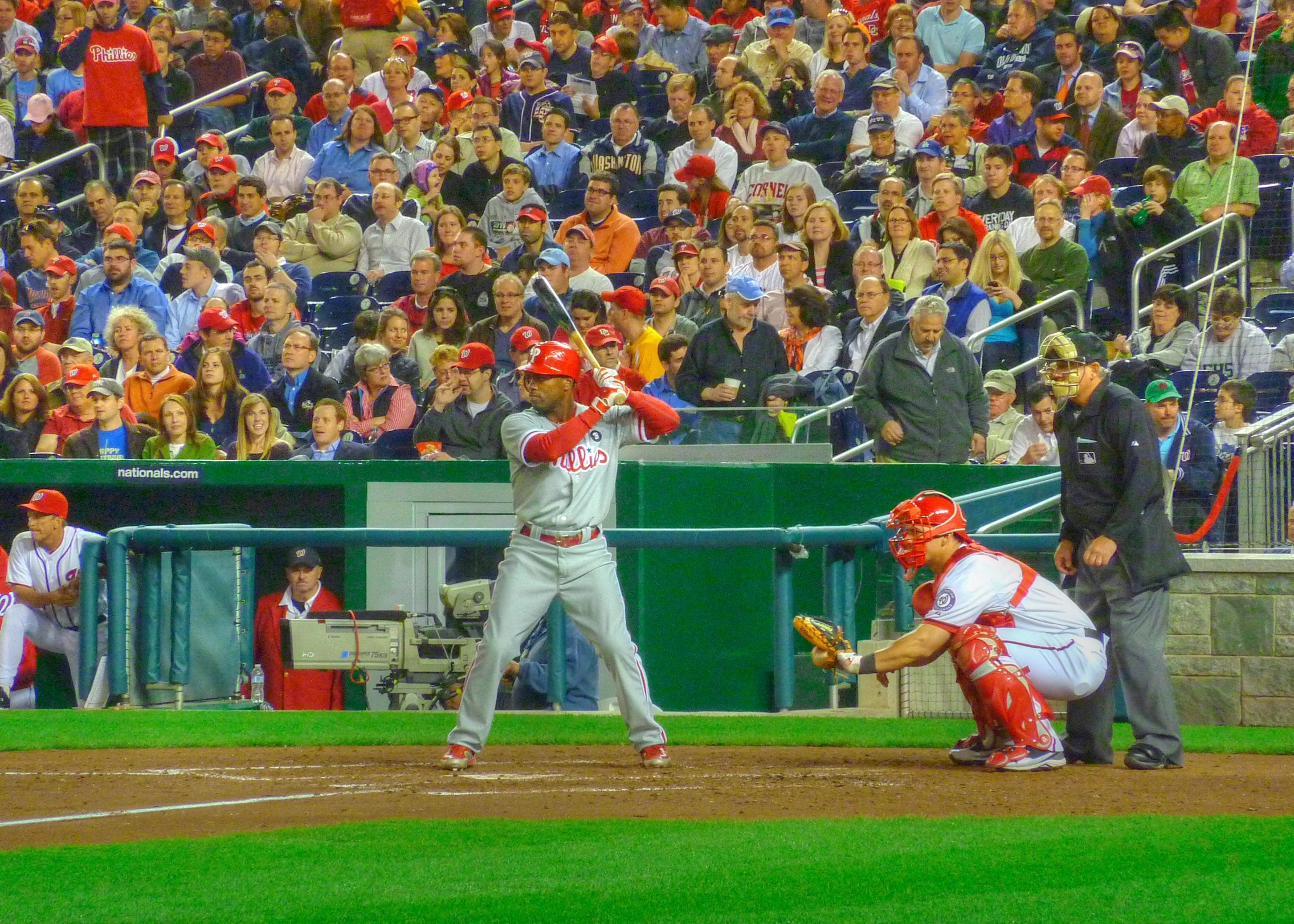 a baseball player is up to bat in front of a large crowd