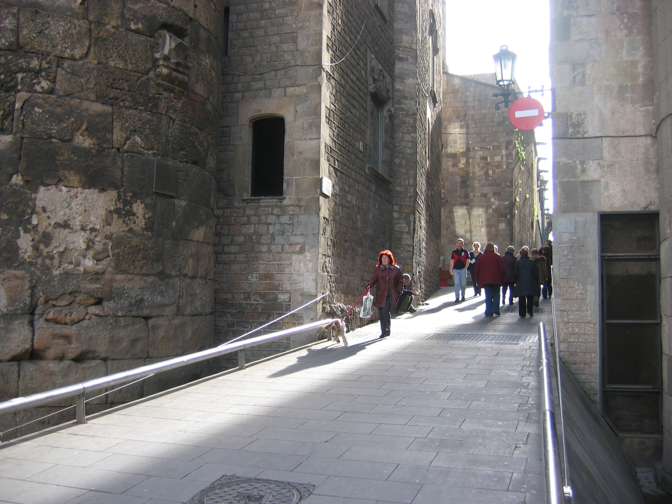 the narrow walkway leads to an old tower