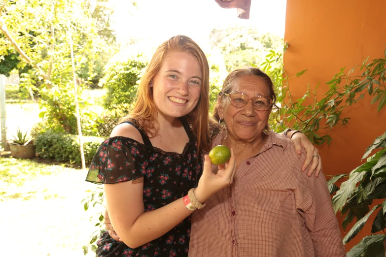 an old woman poses for a po with a younger woman