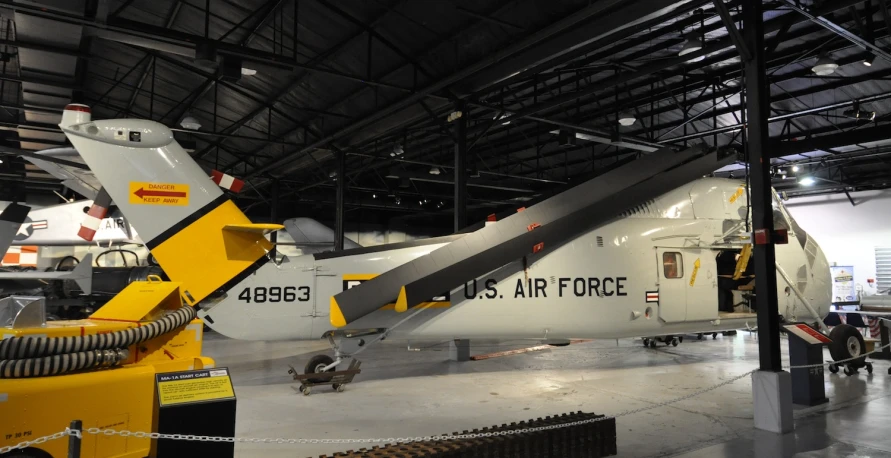 the fighter plane sits in the hangar at the air force museum
