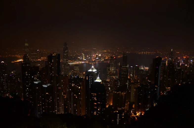 an urban skyline at night with lights lit up