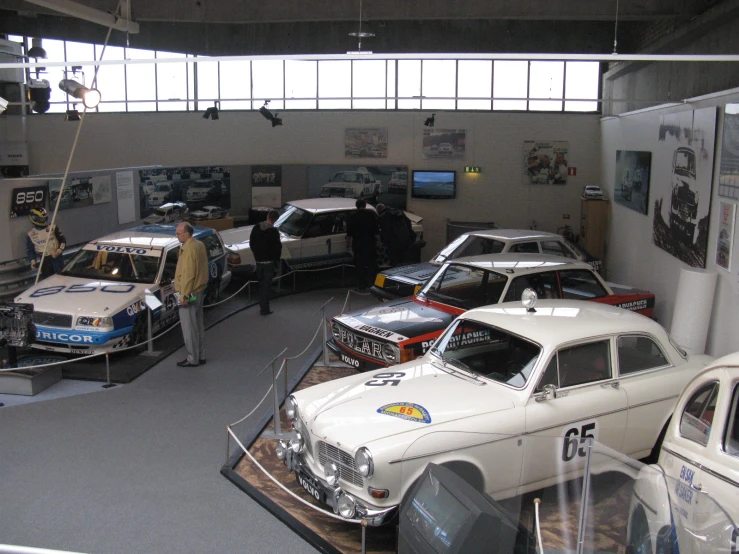 a museum with vintage cars in it