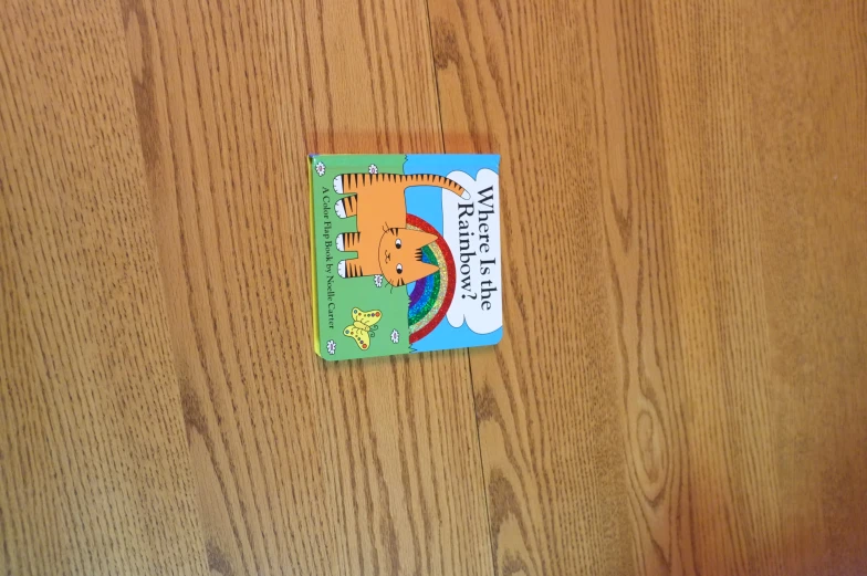 a childrens book on top of a wood table