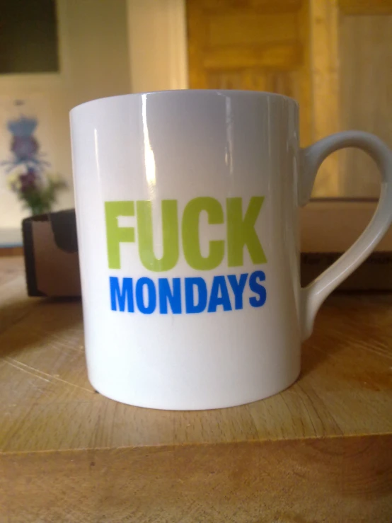 this is a coffee cup that says flickk monday's