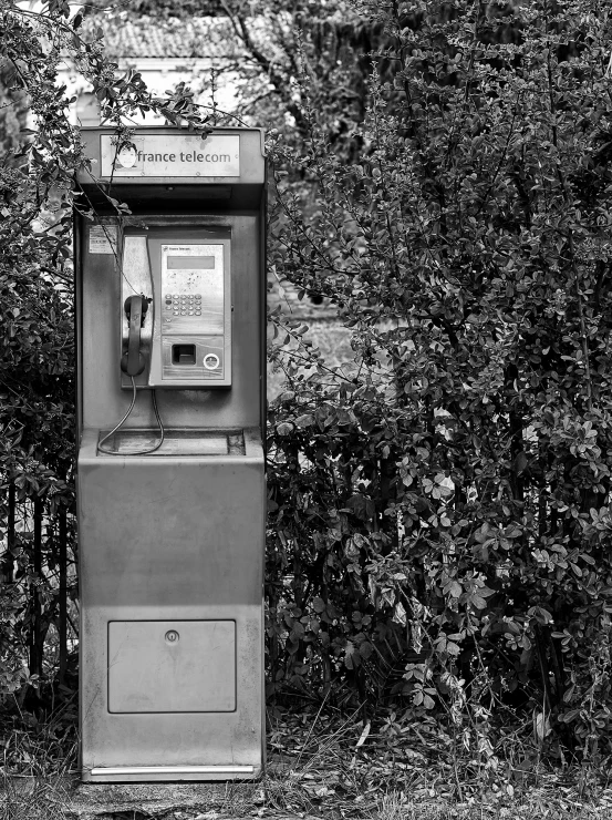 black and white pograph of a phone booth