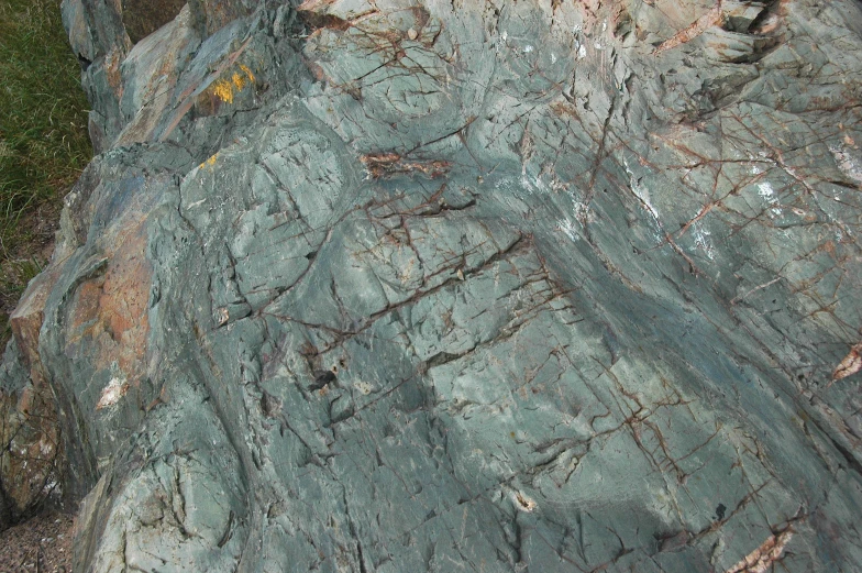 a rock with brown and white lines on it