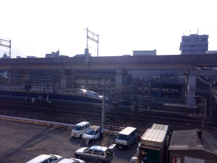 multiple vehicles driving down the tracks in an industrial setting