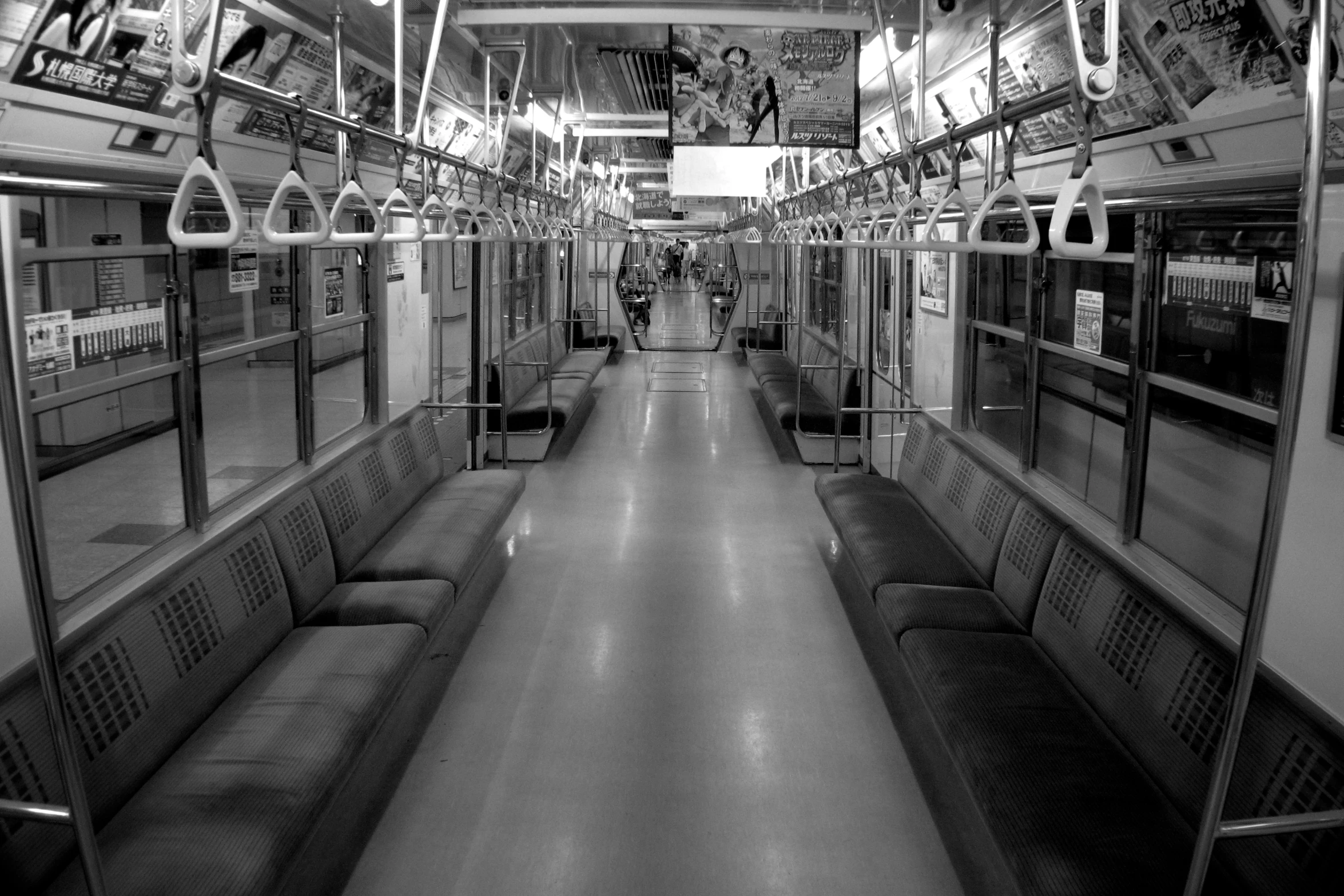 this po is of an indoor subway area with benches and a door