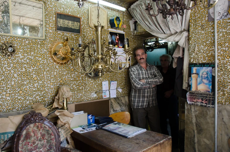 a man looking in a doorway from inside the room