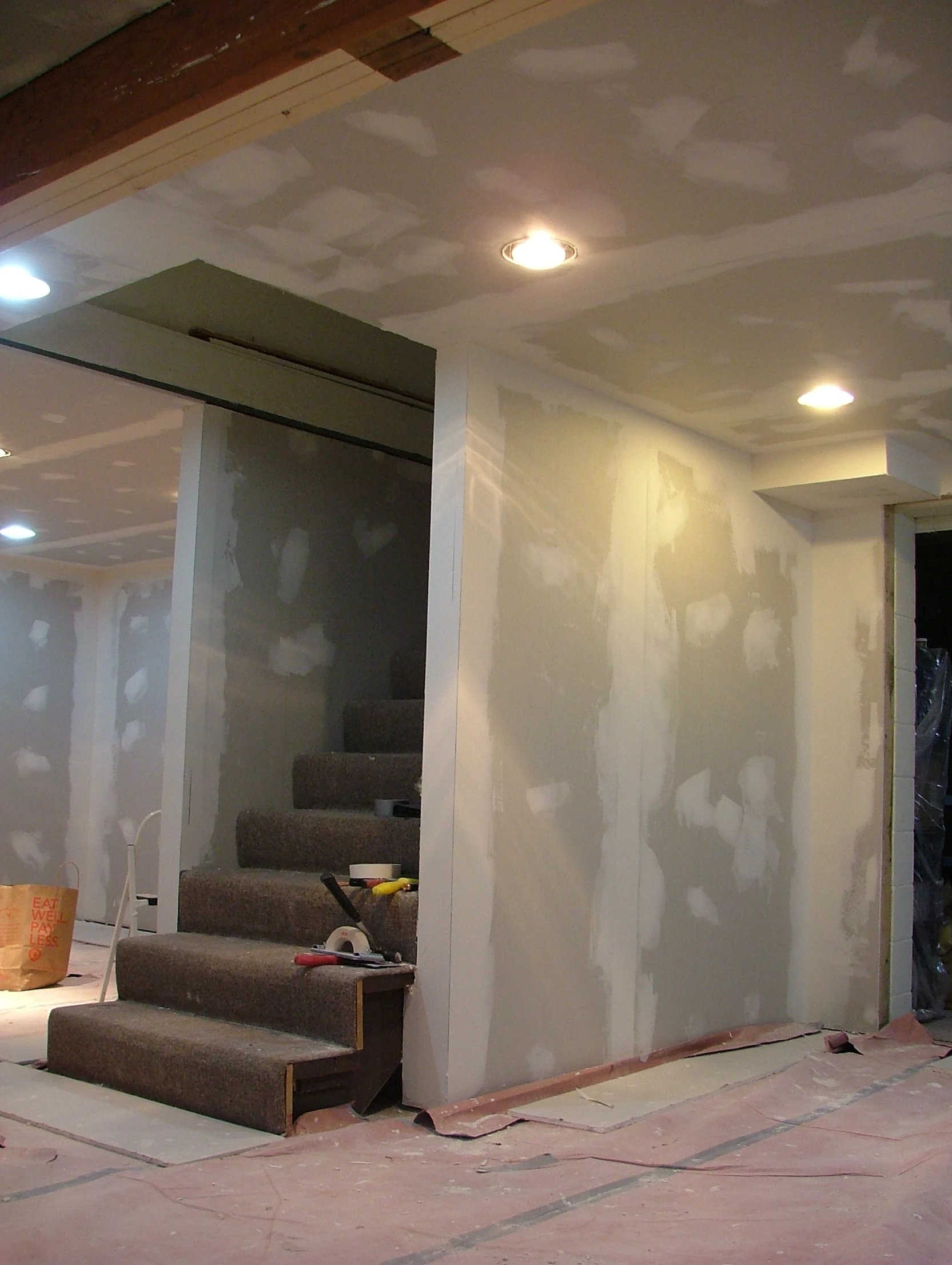 a stairwell, staircase, and light in a building being renovated