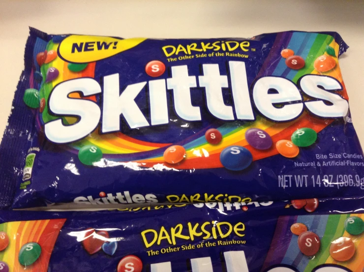 two skittle's with colorful candy on the top