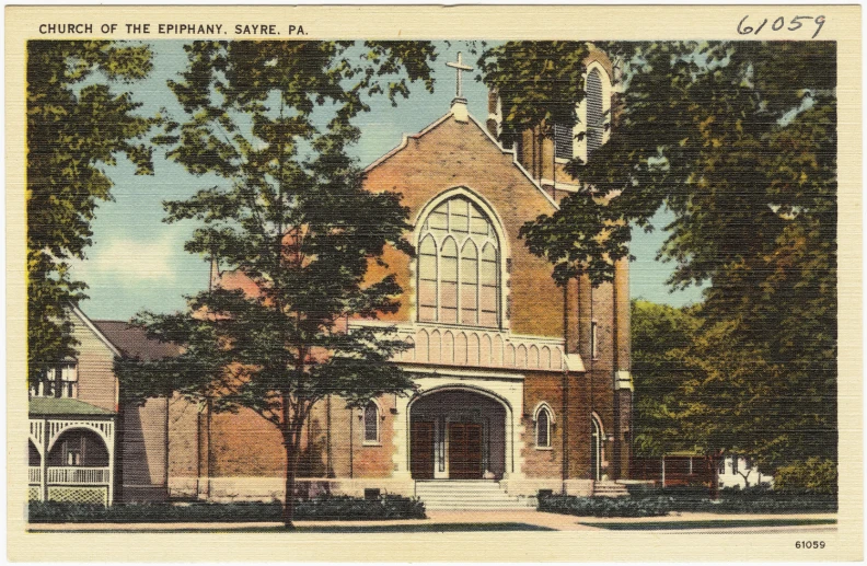 a church with a steeple surrounded by trees