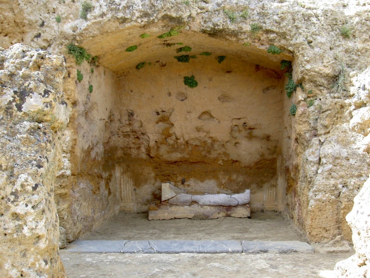 a cave with small beds tucked under the sides