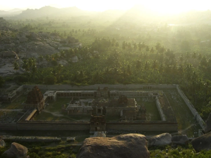 a scenic view of a big building with some trees around