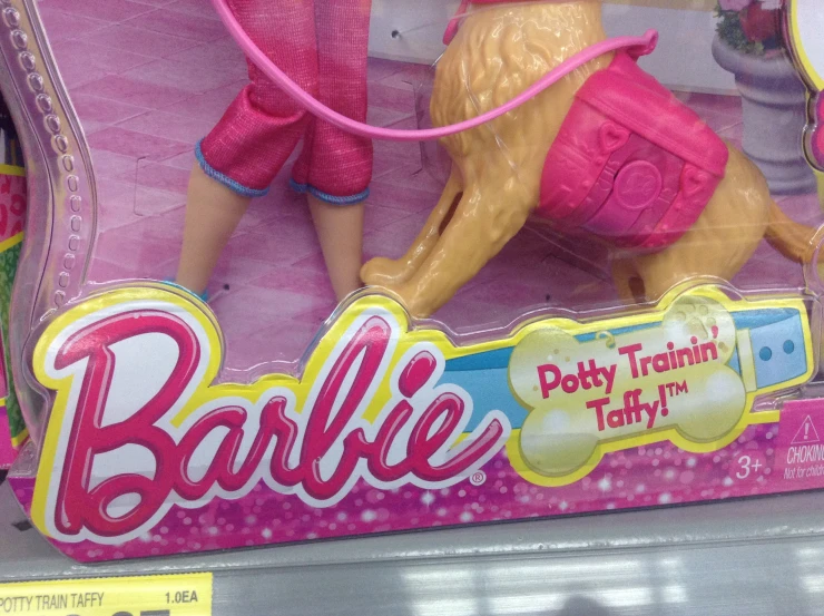 the new barbie has arrived and is pink and gold
