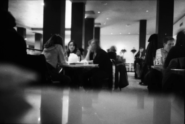 a black and white po of people at a table