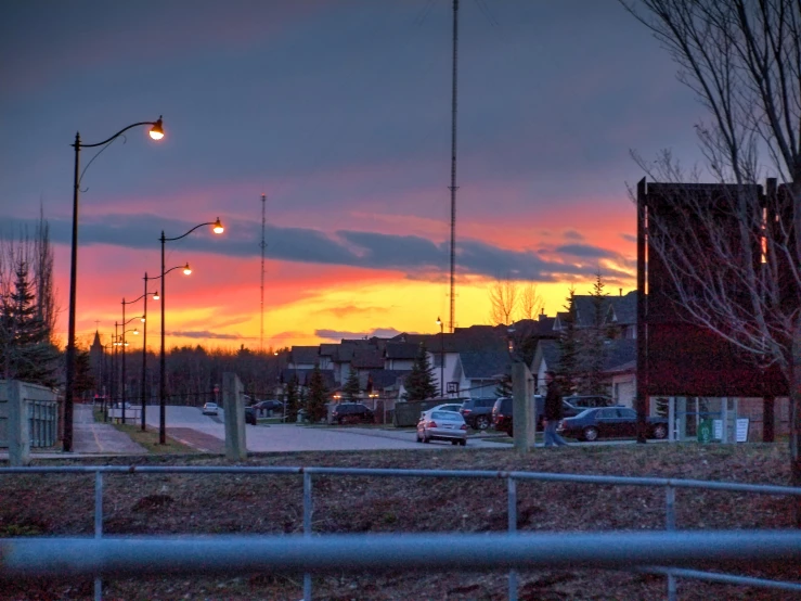 an intersection is at sunset in the background