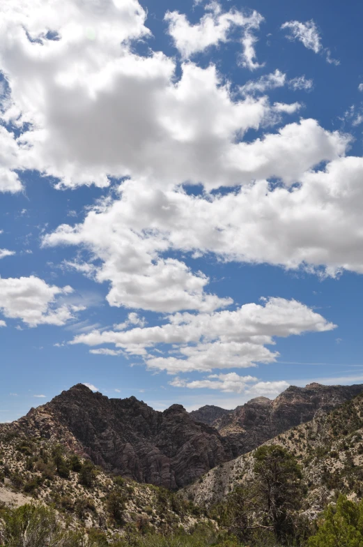 clouds in a blue sky above mountains