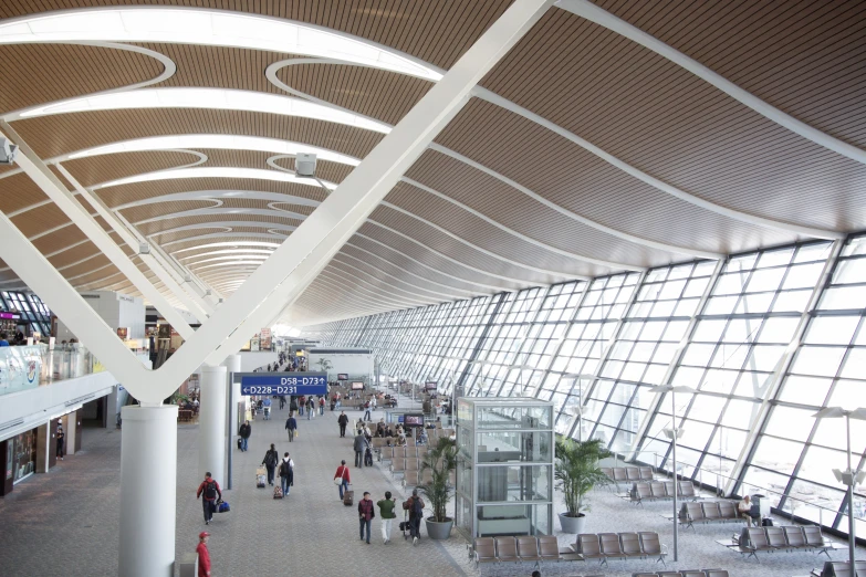 a large terminal with lots of people walking around